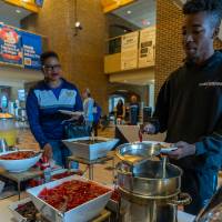 Families grabbing breakfast in Kirkhof Center lobby.